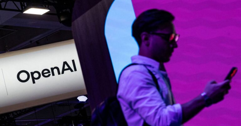 FILE PHOTO: People visit an OpenAI booth at Moscone Center during the Dreamforce 2026 technology summit in San Francisco, California